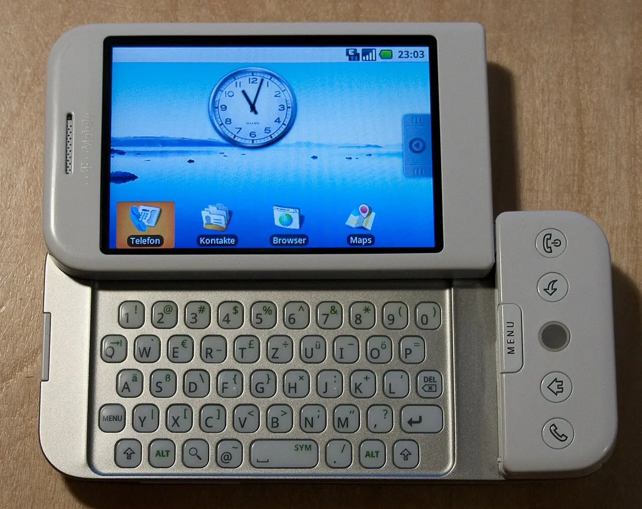 An HTC Dream (T-Mobile G1) slid open to reveal its QWERTY keyboard