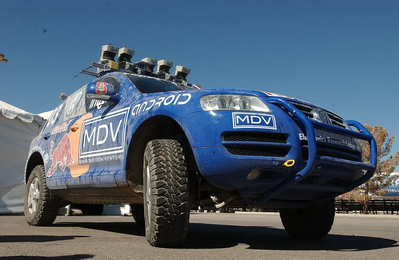 Stanford's Stanley at the 2005 DARPA Grand Challenge: a blue Volkswagen Touareg with five laser range finders on its roof rack