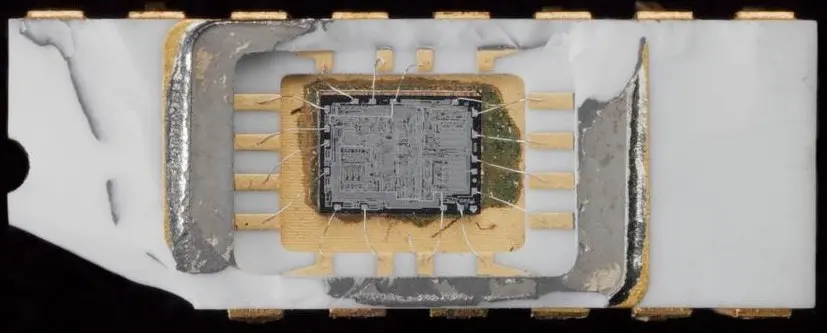 An Intel 4004 (1971) with its package opened, showing the die and bond wires