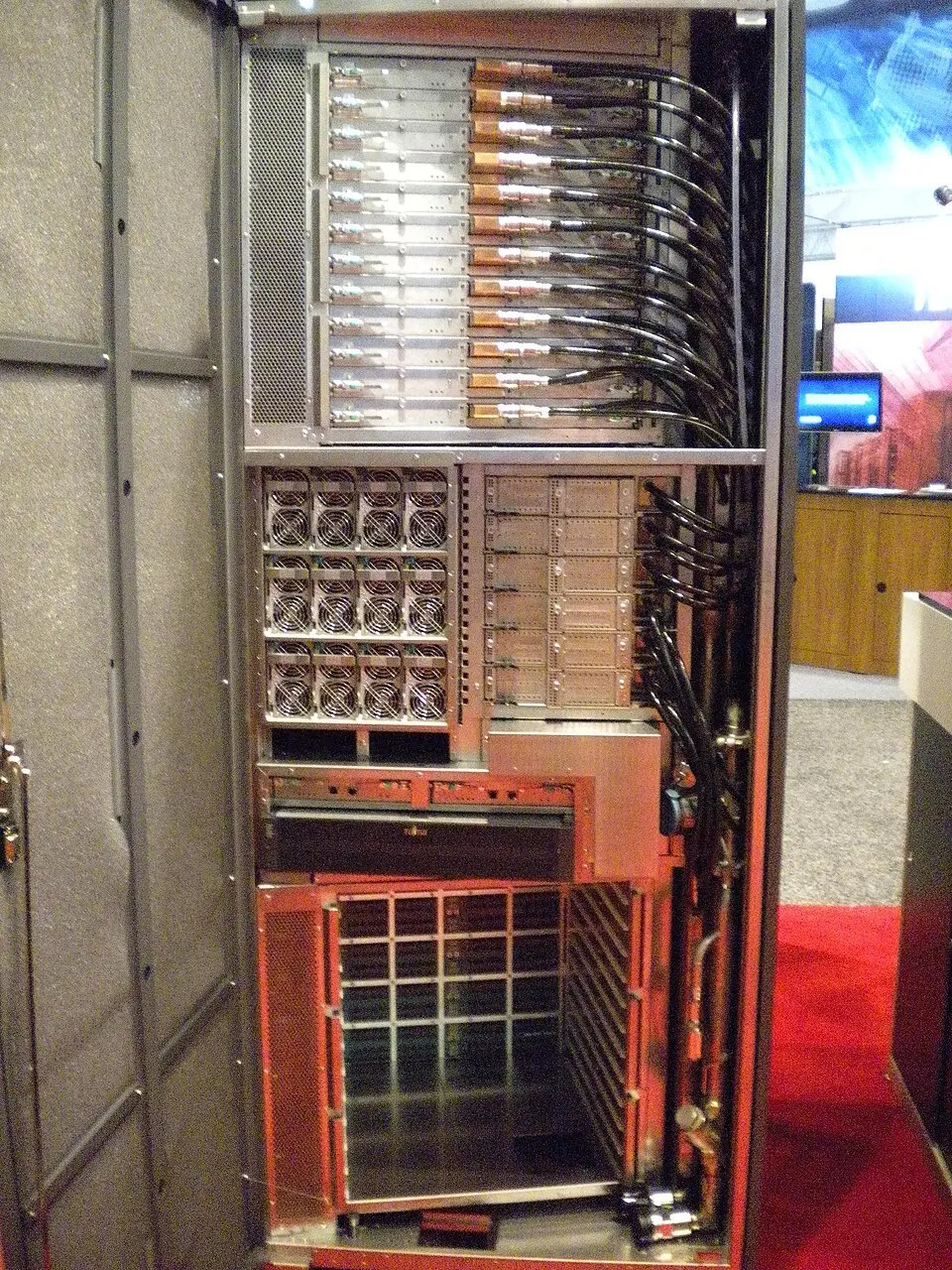 A Fujitsu-built rack of RIKEN's next-generation supercomputer, later named the K computer, shown at SC09 in 2009 with its door open to reveal the boards and cabling