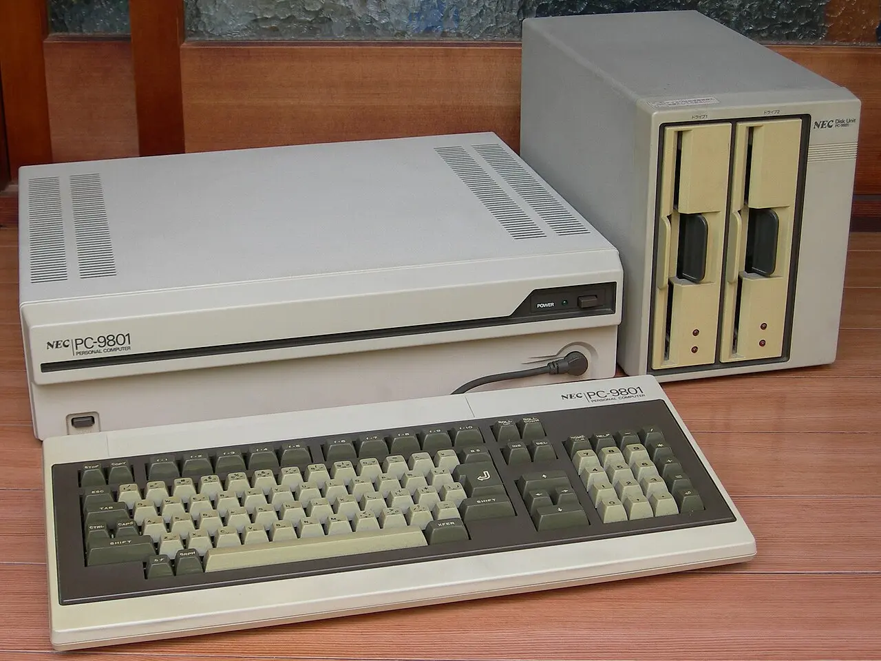 The original PC-9801 with its keyboard, beside the PC-9881 8-inch floppy disk unit