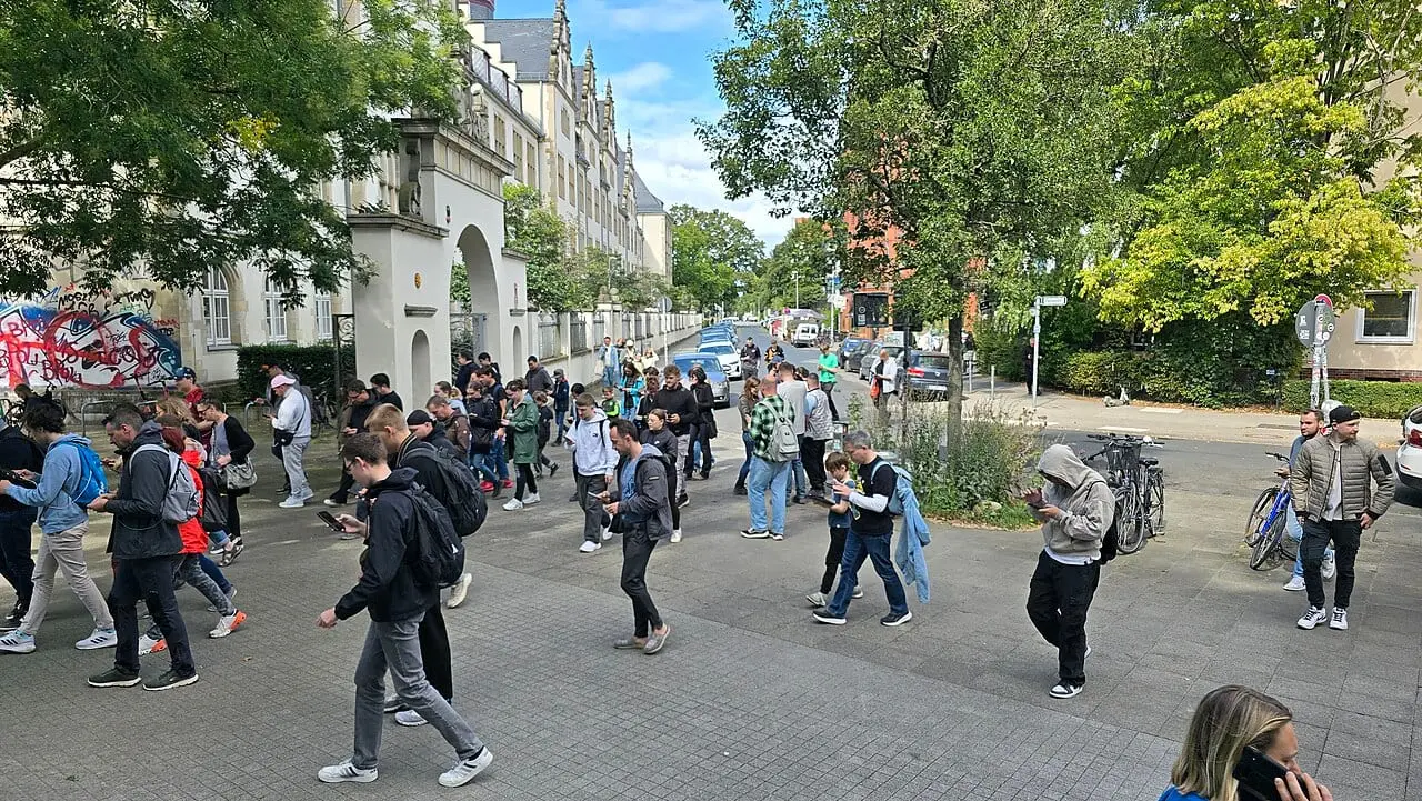 Pokémon GO players in Hanover, Germany, walking the same way with their phones in hand (August 2025)