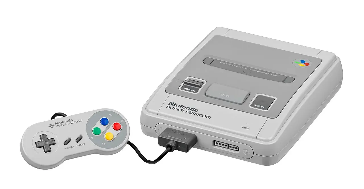 A Japanese Super Famicom with its controller, which added the X, Y, L and R buttons