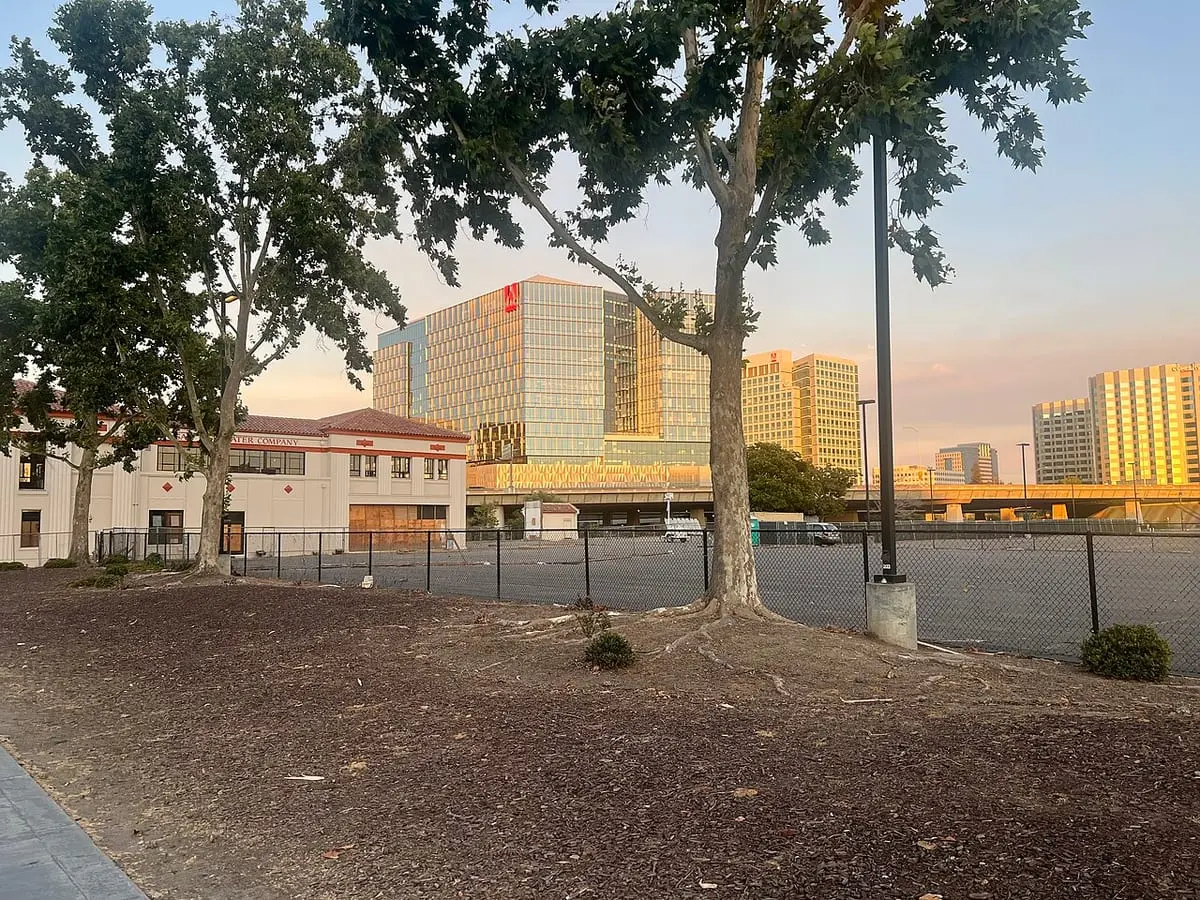 Adobe's headquarters in San Jose, California, the tower with the red logo at centre, photographed in 2023