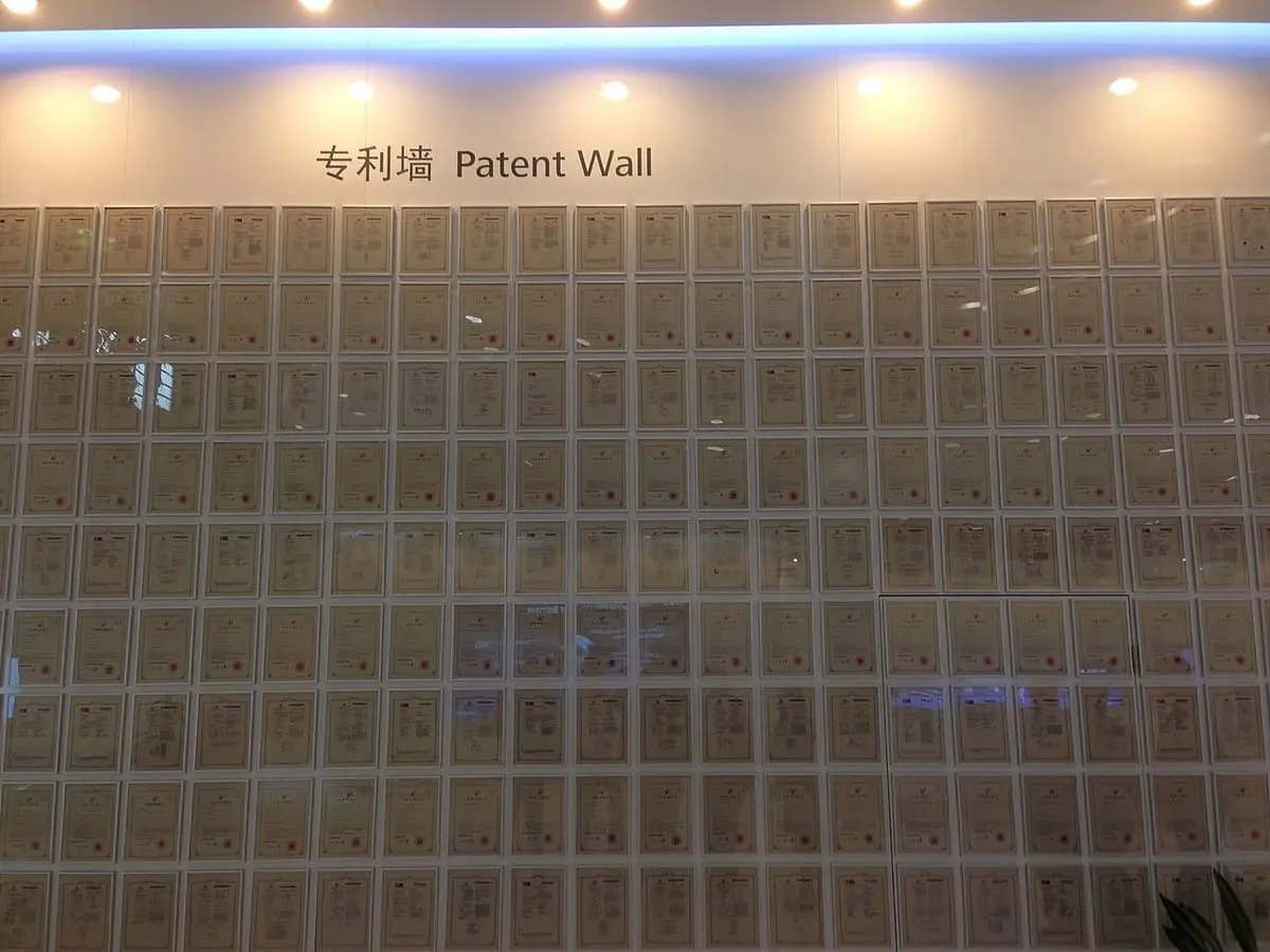 The "Patent Wall" of framed patent certificates at Huawei's headquarters in Shenzhen, photographed in 2014